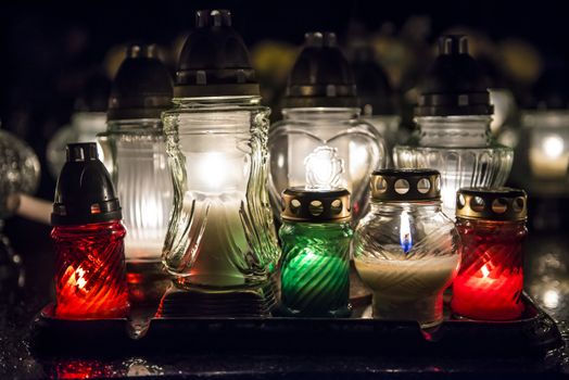 Candles on a grave at night