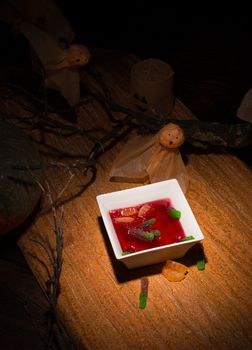 Halloween party dessert for kids,  jelly resembling a blood soup with floating worms