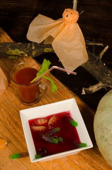 Blood soup with floating worms, a funny kid Halloween meal dessert