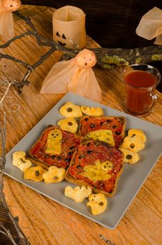 Slices of toast prepared and decorated for a kid Halloween party