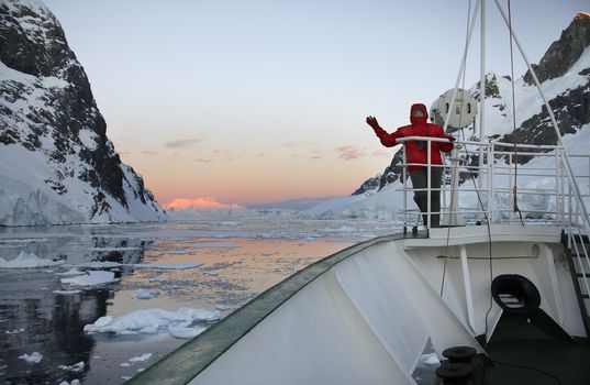 Midnight Sun - Adventure tourist and Russian Icebreaker in the Lamaire Channel in Antarctica (Model Released)