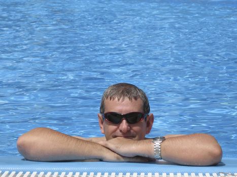Man in swimming pool on Vacation
