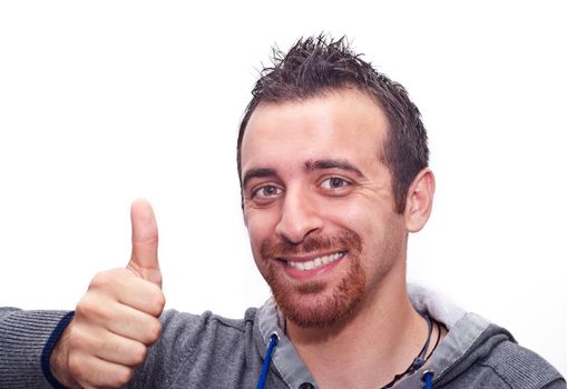 Portrait Of A Happy Young Man Showing Thumb Up Sign Isolated On White Background