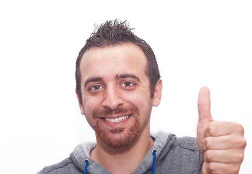 Portrait Of A Happy Young Man Showing Thumb Up Sign Isolated On White Background