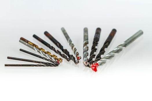 Assorted drill bits on isolated white background