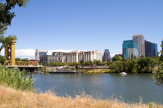Skyline view of Sacramento, the state capital of California as seen from across the river.