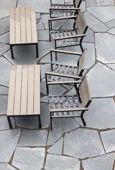 Outdoor cafe after the rain, rain drops on the chairs.