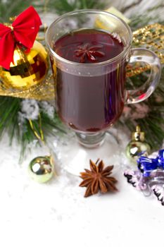 Christmas mug with tea decorated  with red and green snowflakes pine and fir cone ornament