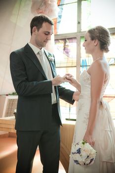 Beautiful bride in white with handsome groom on wedding day