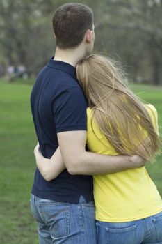 Portrait of love couple embracing outdoor