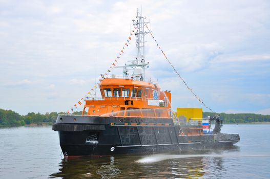 Black-orange ship in Volga river, Yaroslavl, Russia