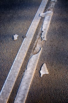 Brocken line of a road marking close-up, Sergiev Posad, Moscow region, Russia