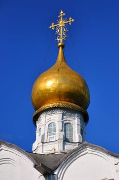 White orthodox church with a golden dome, Sergiev Posad, Moscow region, Russia