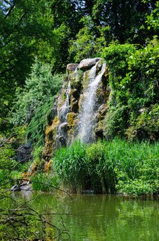 Water fall and a lake in Palmen Garten, Frankfurt am Main, Hessen, Germany