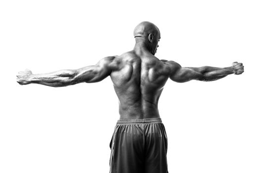 Toned and ripped lean muscle fitness man isolated over a white background in high contrast black and white.