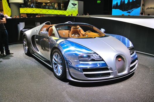 FRANKFURT - SEPT 14: Bugatti Veyron Grand Sport LOr Blanc presented as world premiere at the 65th IAA (Internationale Automobil Ausstellung) on September 14, 2013 in Frankfurt, Germany