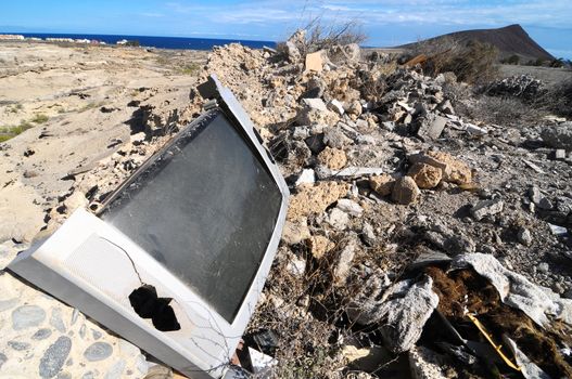 A Broken Gray Television Abandoned in the Desert