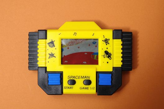 One Old Yellow Vintage Videogame with four Buttons