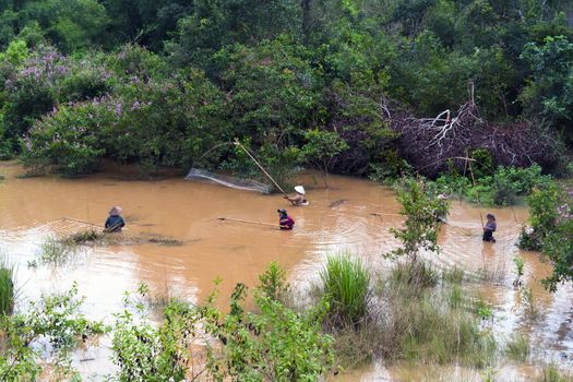 Lao Women Catch Fish in River. Khammouane province. EDITORIAL.