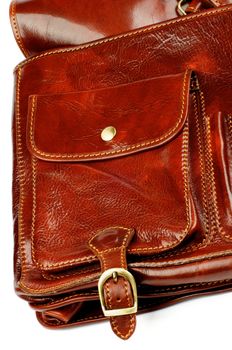 Details of Ginger Leather Traveling Bag with Pocket and Bronze Rivetcloseup on white background