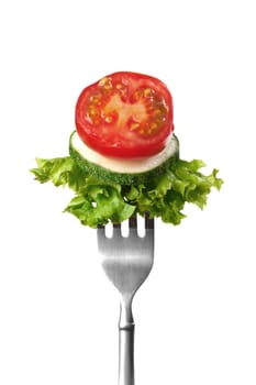 Close-up of salad on a fork, isolated on a white background.