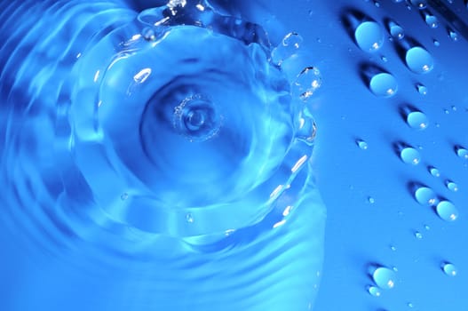 Some Water Drops on a Blue Textured Background