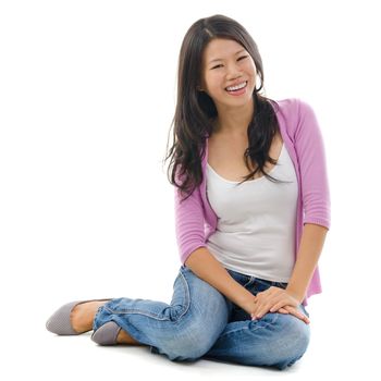 Portrait of Asian female smiling and sitting isolated over white background.