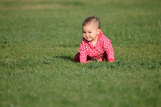 cute baby on a green grass