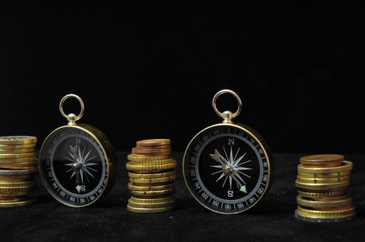 Orientation in  Business Compass and Money on a Black Background