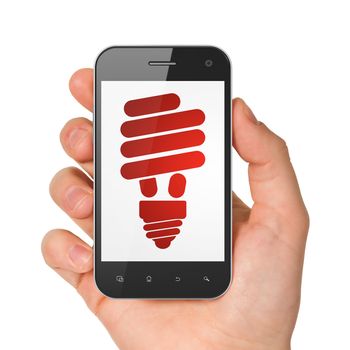 Finance concept: hand holding smartphone with Energy Saving Lamp on display. Mobile smart phone in hand on White background, 3d render