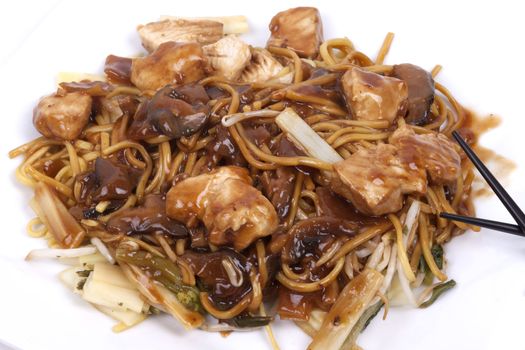cooked noodles with pieces of chicken breast and vegetables in savoury mushroom sauce
