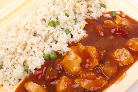 Closeup photo of take away chinese sweet and sour chicken with rice.