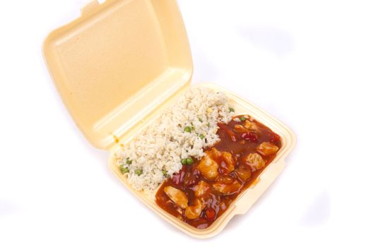 Closeup photo of take away chinese sweet and sour chicken with rice.