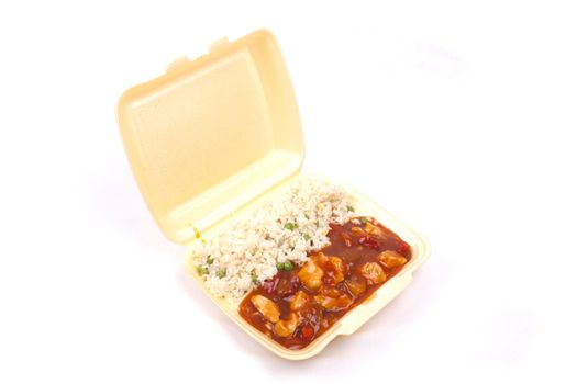 Closeup photo of take away chinese sweet and sour chicken with rice.