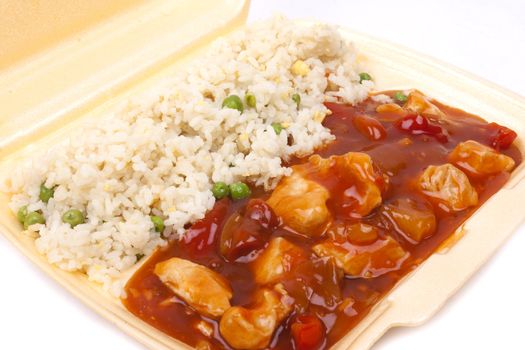 Closeup photo of take away chinese sweet and sour chicken with rice.