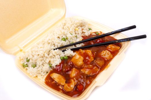 Closeup photo of take away chinese sweet and sour chicken with rice.