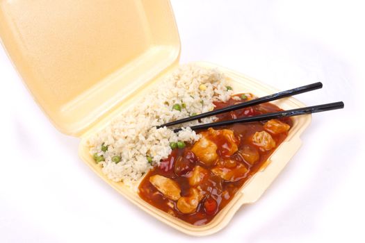 Closeup photo of take away chinese sweet and sour chicken with rice.