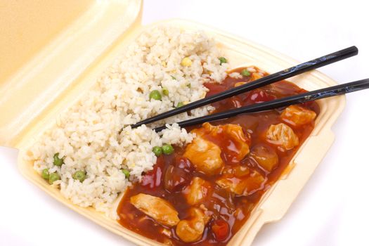 Closeup photo of take away chinese sweet and sour chicken with rice.