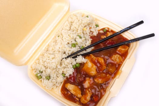 Closeup photo of take away chinese sweet and sour chicken with rice.