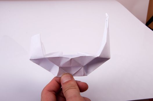 An image of white origami boat 