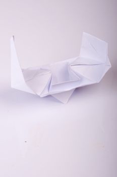 An image of white origami boat 