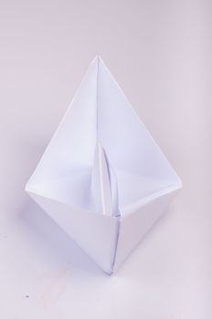 An image of white origami boat 