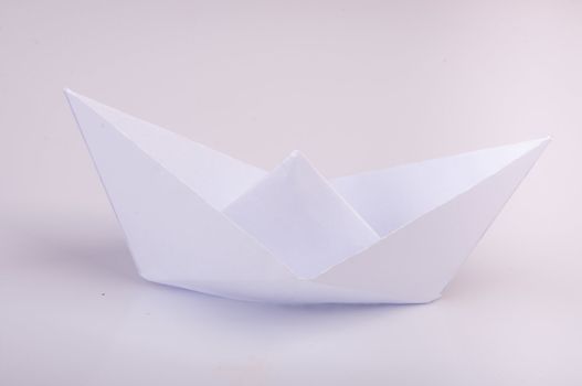 An image of white origami boat 