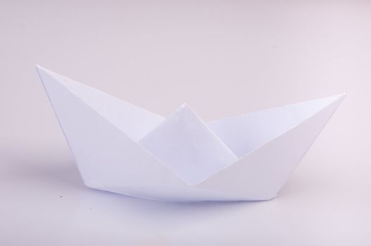 An image of white origami boat 