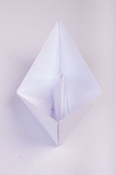An image of white origami boat 