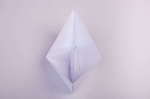 An image of white origami boat 