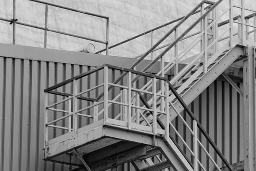 industrial stairs with stair railing wide by building