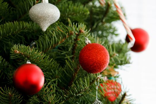 Christmas ornaments hanging from a tree.