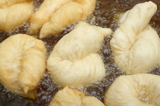 Close up Deep fried doughstick in Fryer