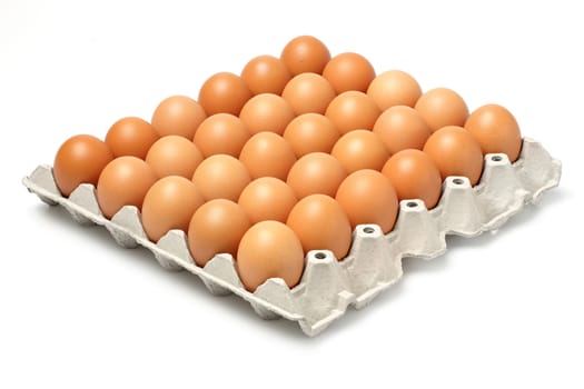 Eggs in paper tray isolated on white